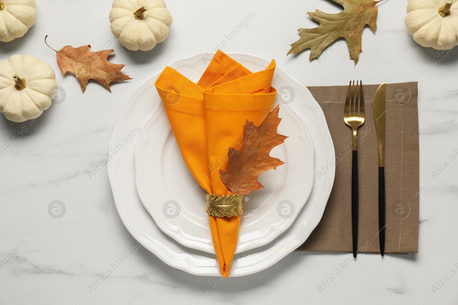 Photo of Stylish autumn table setting on white marble background, flat lay