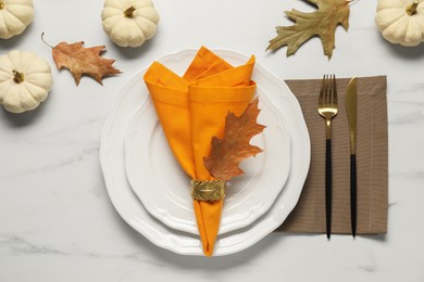 Stylish autumn table setting on white marble background, flat lay