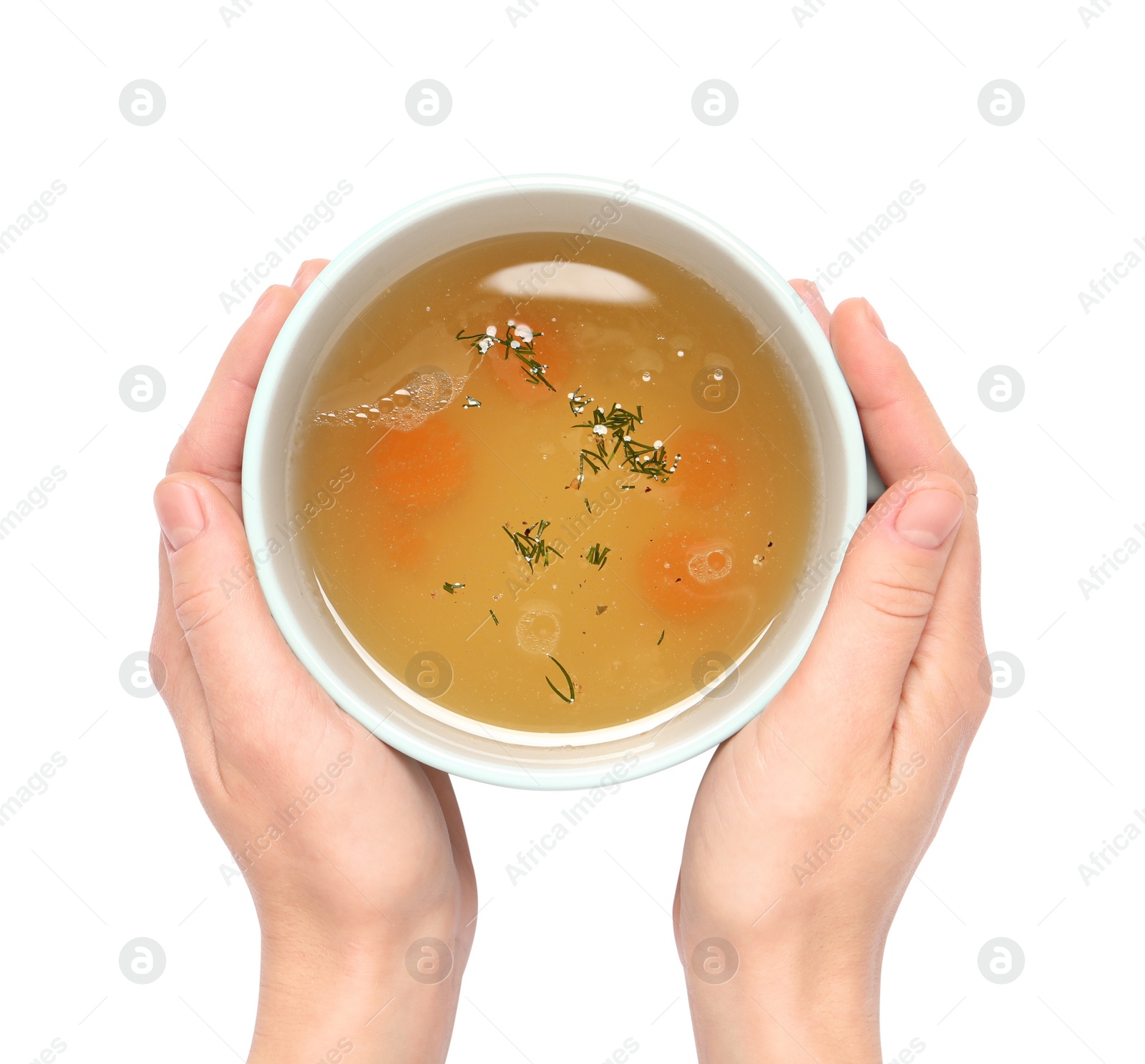 Photo of Woman with cup of hot delicious bouillon on white background, top view