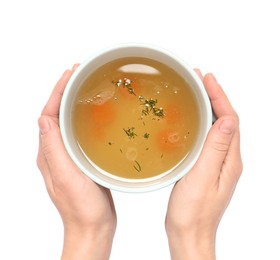 Photo of Woman with cup of hot delicious bouillon on white background, top view