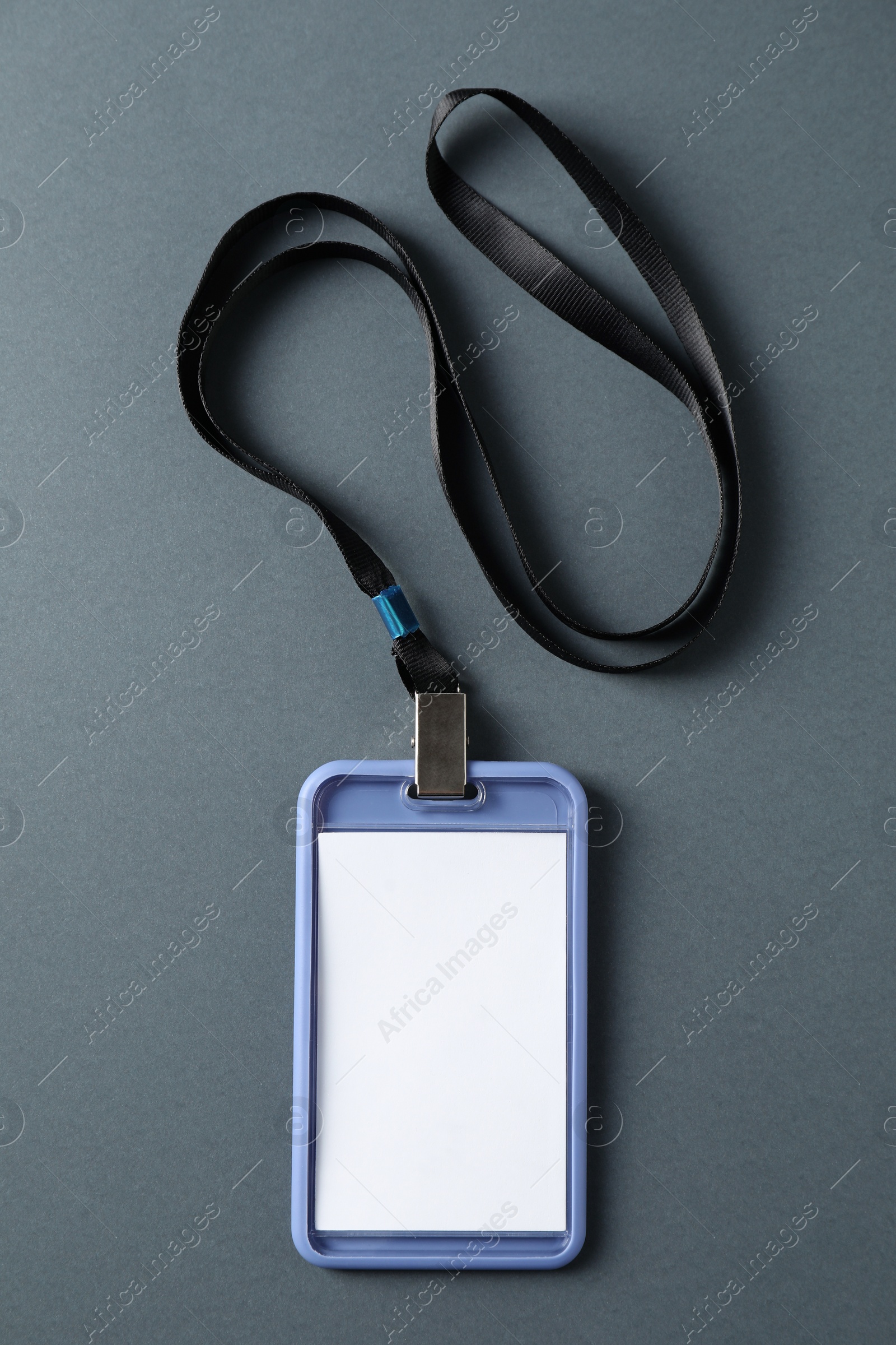 Photo of Blank badge with string on grey background, top view