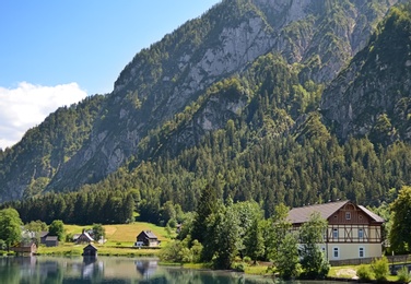 Beautiful landscape with mountains and river on sunny day