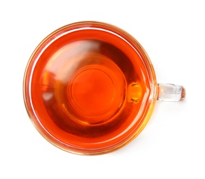 Glass cup of hot aromatic tea on white background