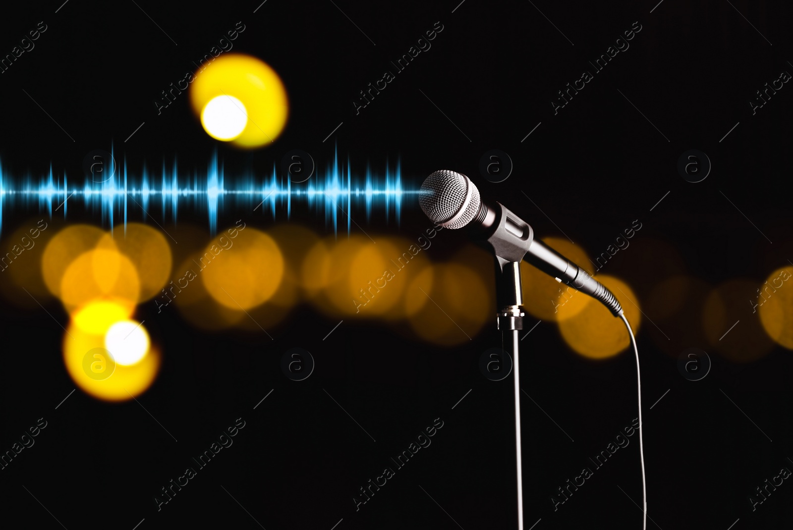 Image of Microphone and radio wave on dark background, bokeh effect