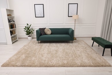 Photo of Stylish living room with soft beige carpet and furniture. Interior design