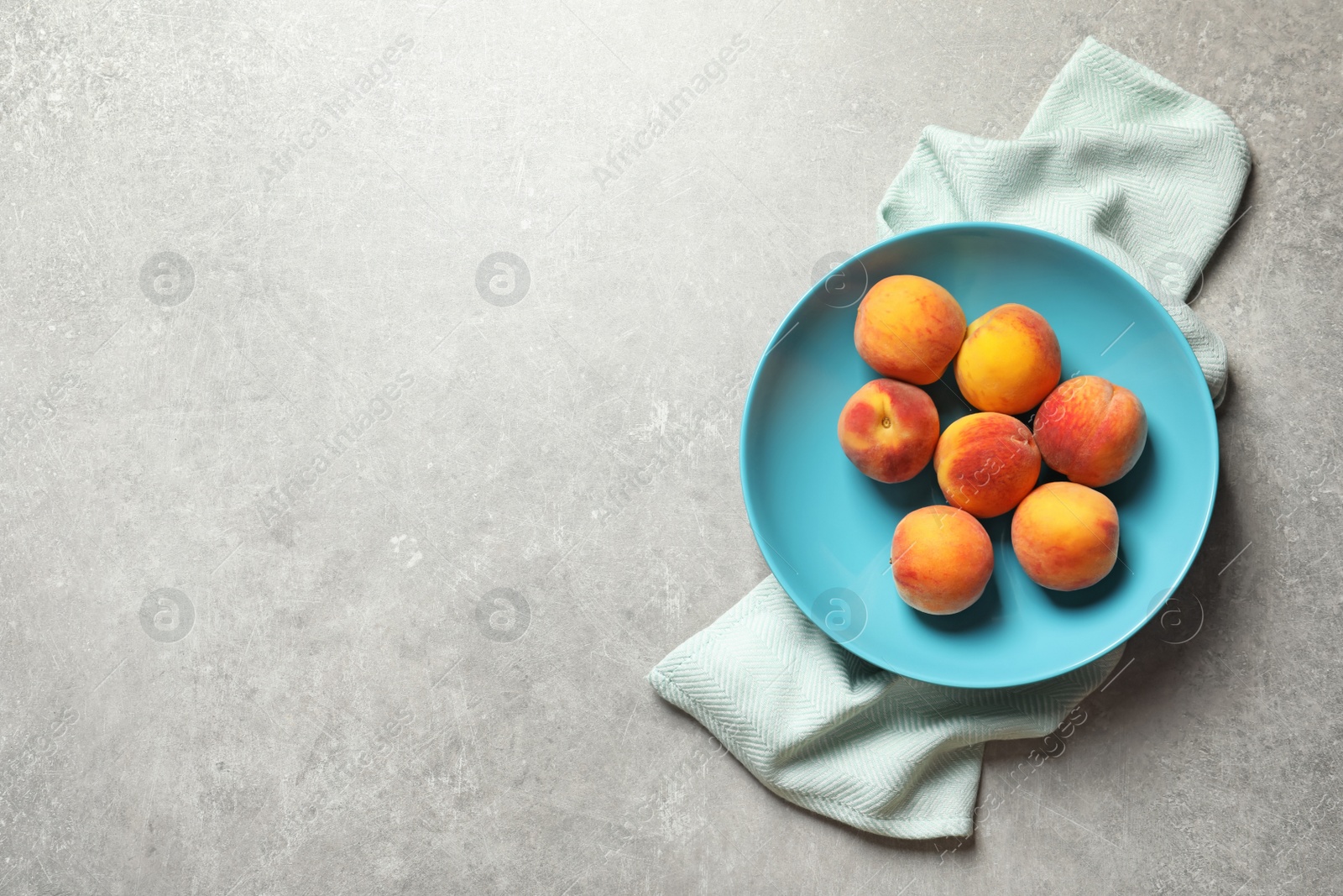 Photo of Plate with fresh sweet peaches on table, top view