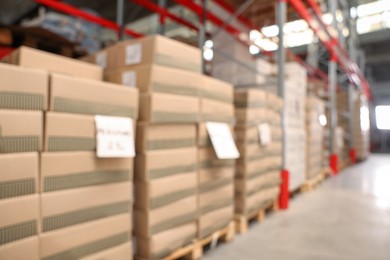 Blurred view of warehouse with boxes. Wholesaling