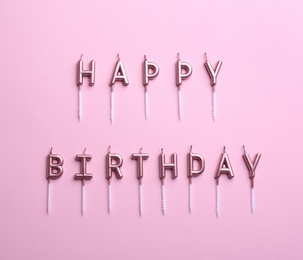 Photo of Flat lay composition with birthday candles on color background