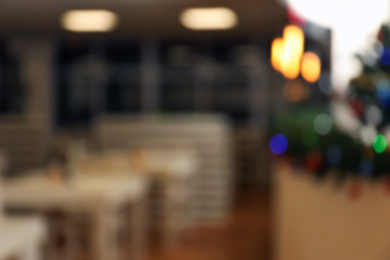 Photo of Blurred view of modern school canteen with festive decor