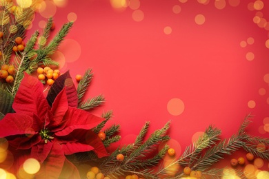 Image of Flat lay composition with traditional Christmas poinsettia flower and space for text on red background, bokeh effect 