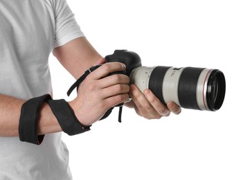 Photographer holding modern camera on white background, closeup