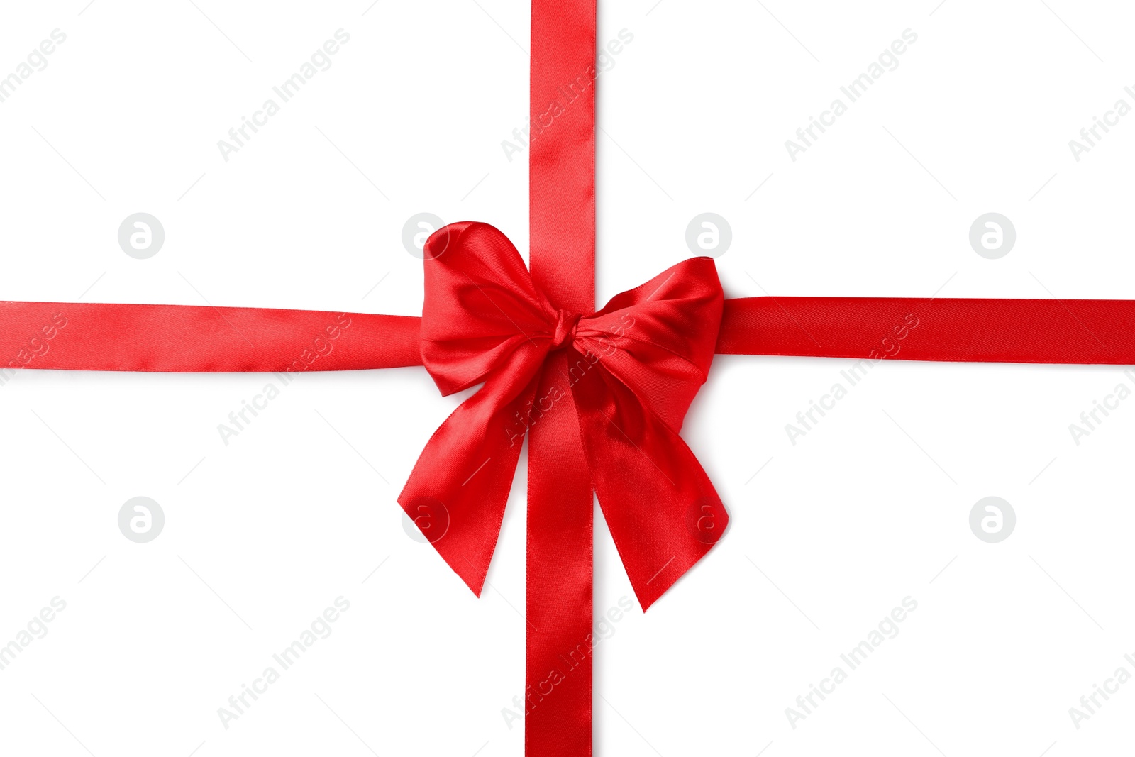 Photo of Red bow and ribbon on white background, top view