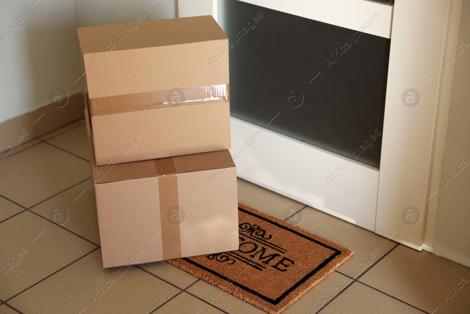 Photo of Parcels delivered on mat near front door