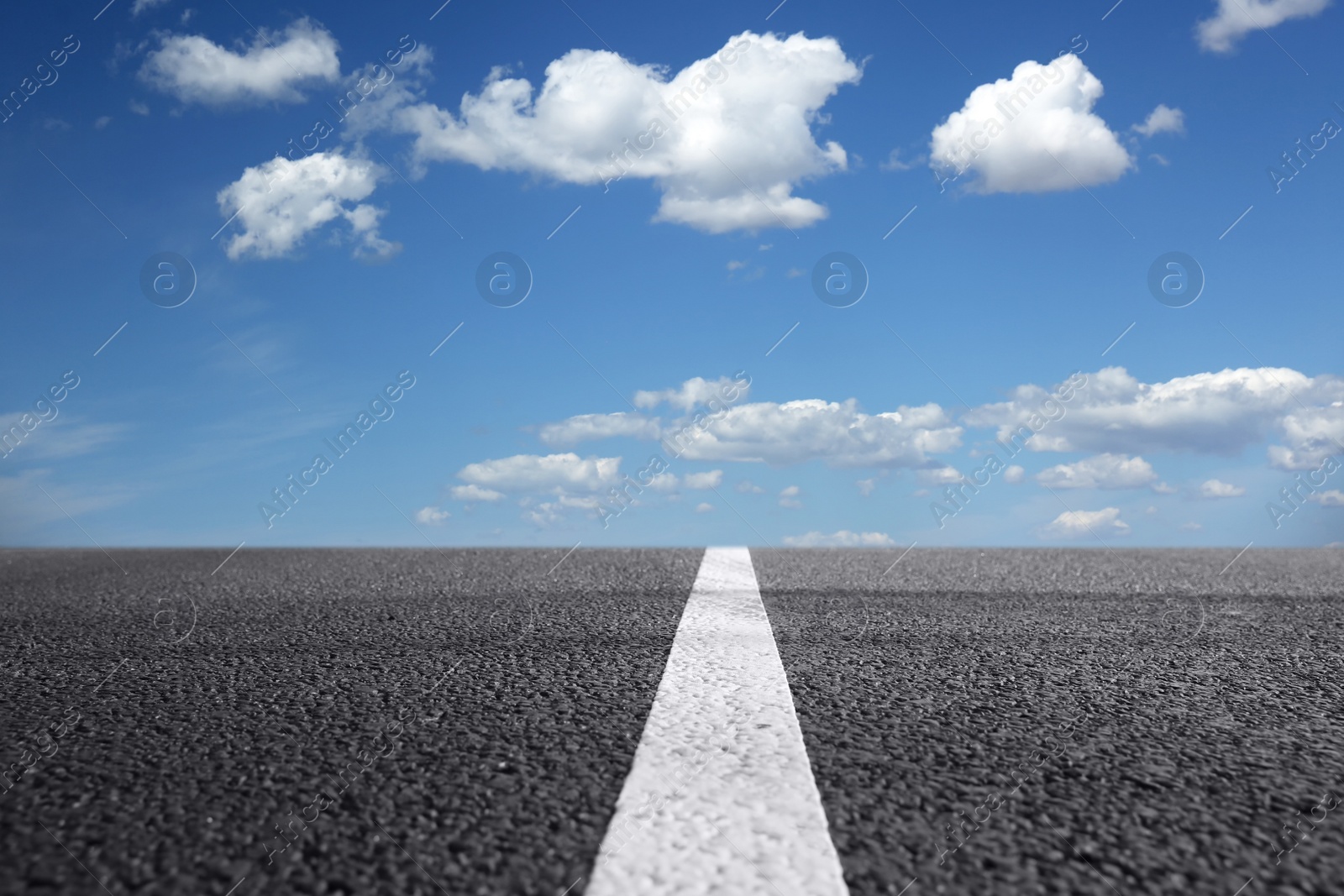 Image of View of empty asphalt road on sunny day