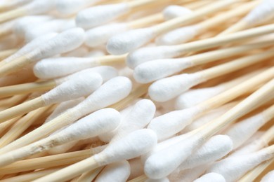 Many cotton buds as background, closeup view