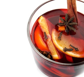 Photo of Glass of mulled wine with spices isolated on white