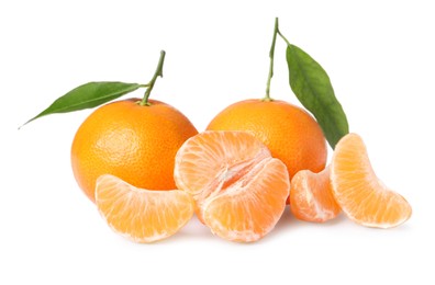 Photo of Fresh ripe juicy tangerines with green leaves isolated on white