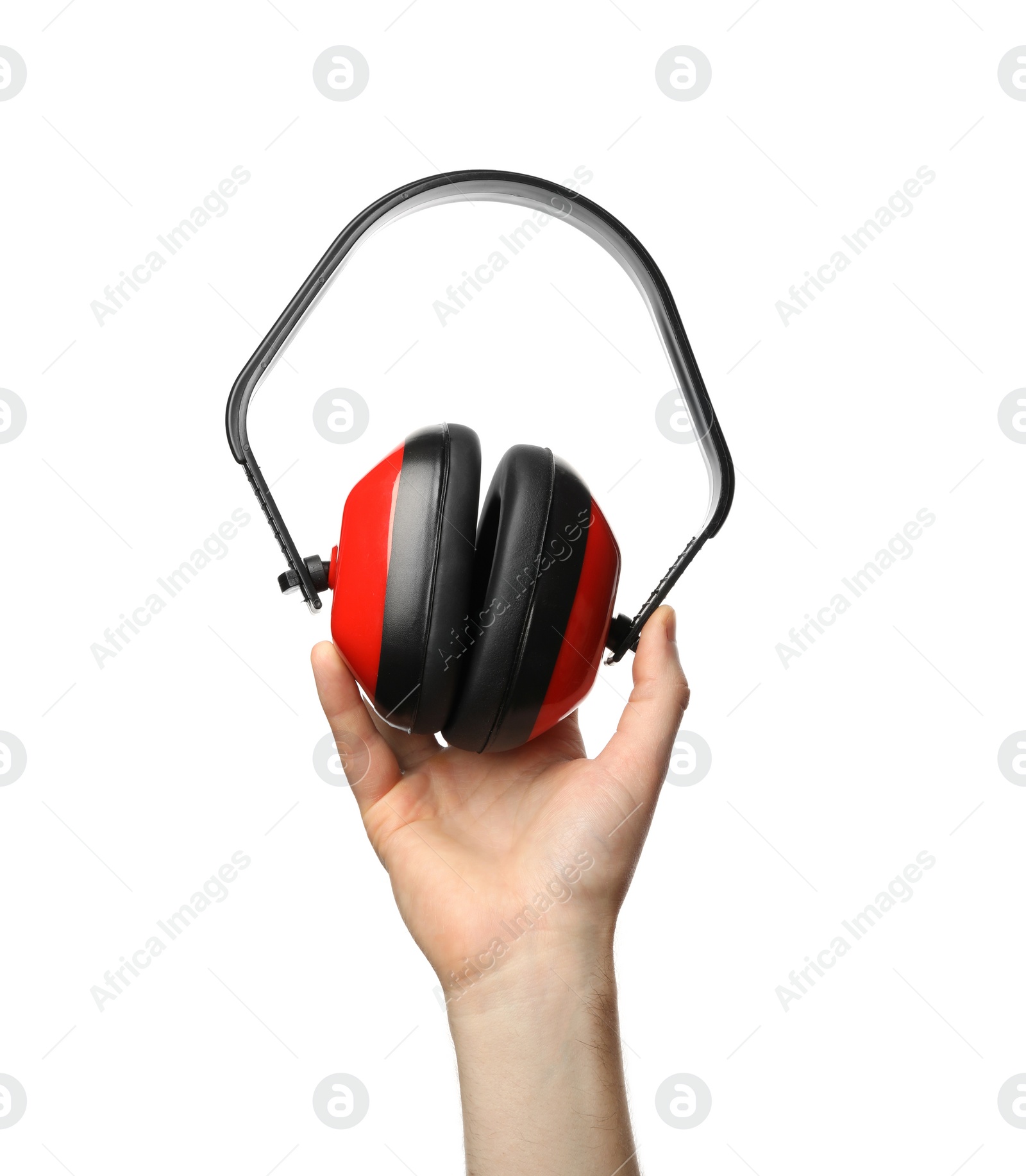 Photo of Man holding protective headphones isolated on white, closeup