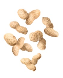 Unpeeled peanuts in air on white background