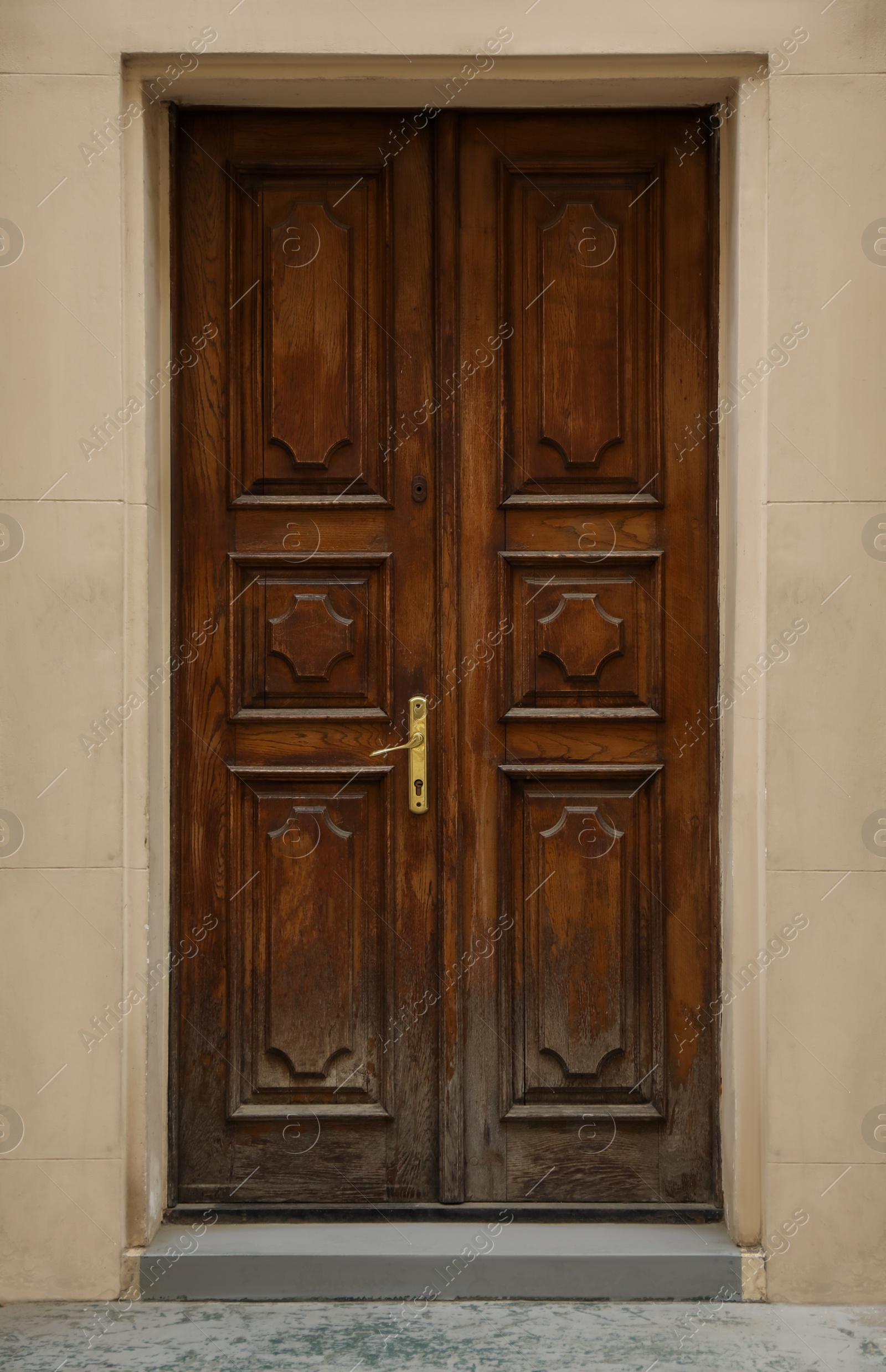 Photo of View of building with wooden door. Exterior design