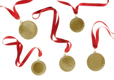 Gold medals with ribbons isolated on white, set