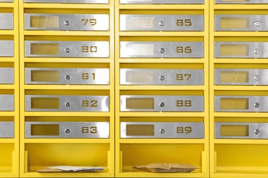 Photo of Metal mailboxes with keyholes, numbers and correspondence in post office