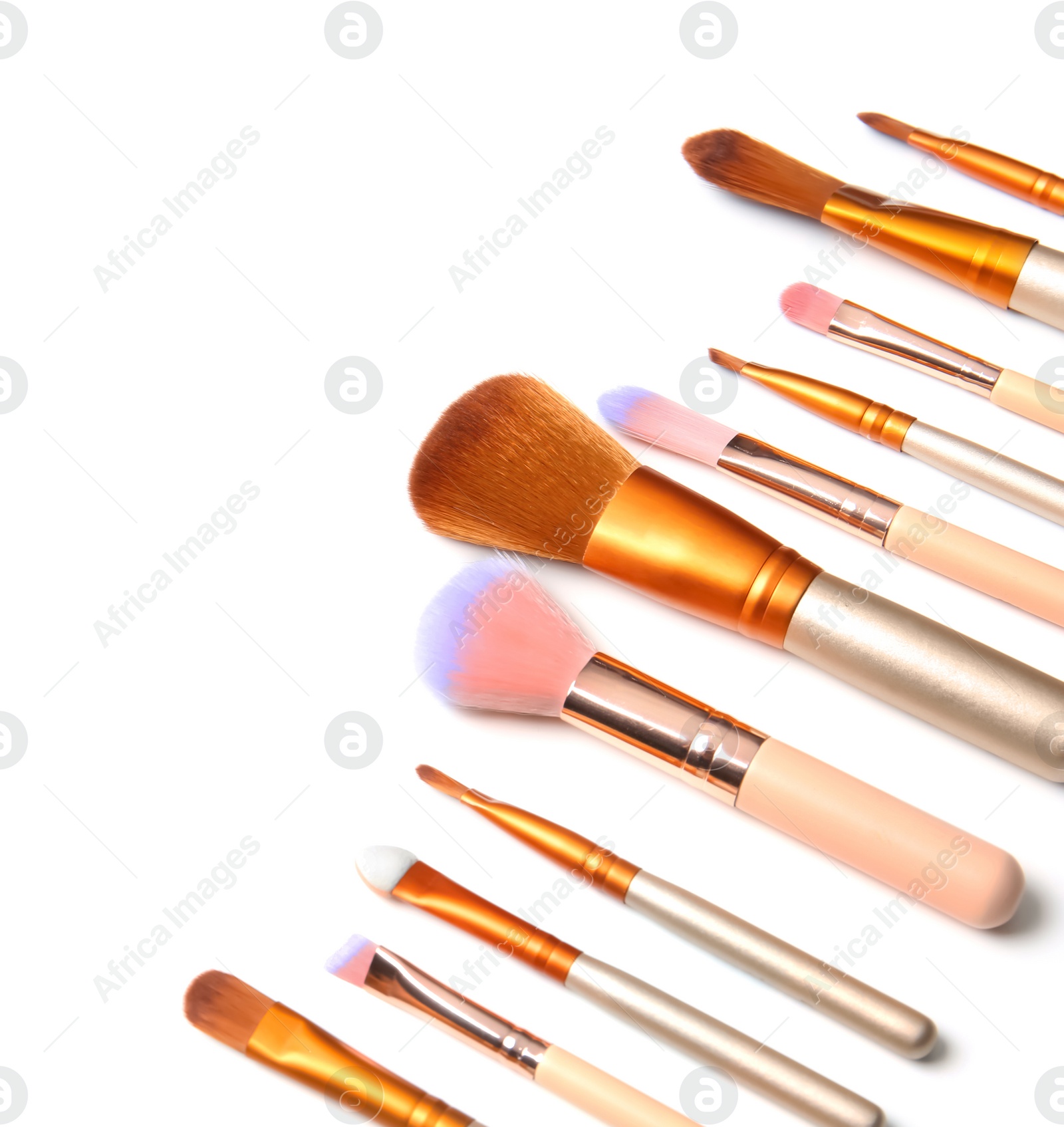 Photo of Makeup brushes of professional artist on white background