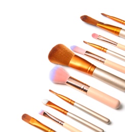 Photo of Makeup brushes of professional artist on white background