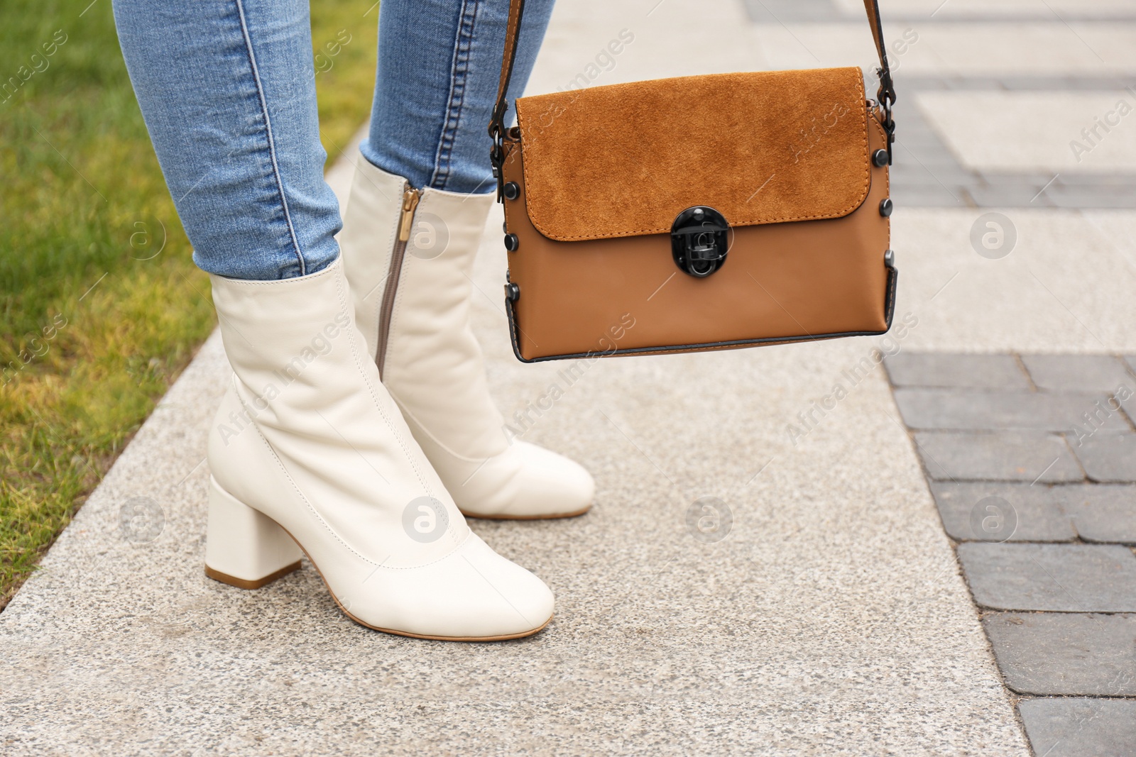 Photo of Woman in stylish leather shoes with bag outdoors, closeup