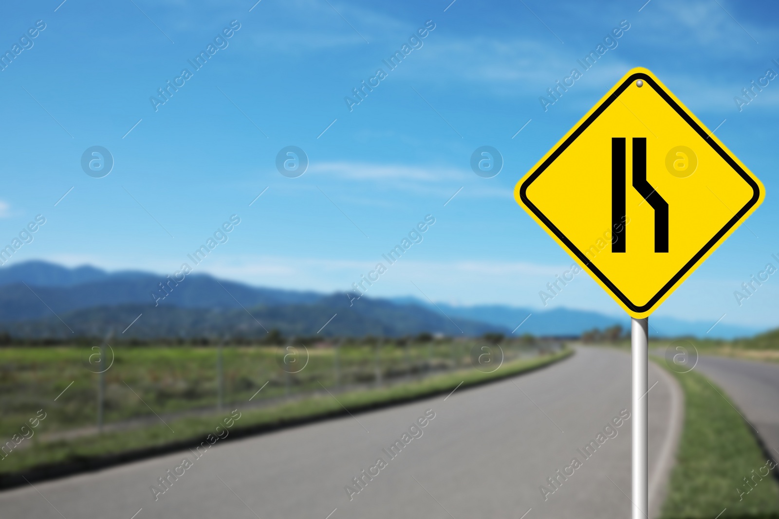 Image of Road Narrows On Right road sign on highway, space for text