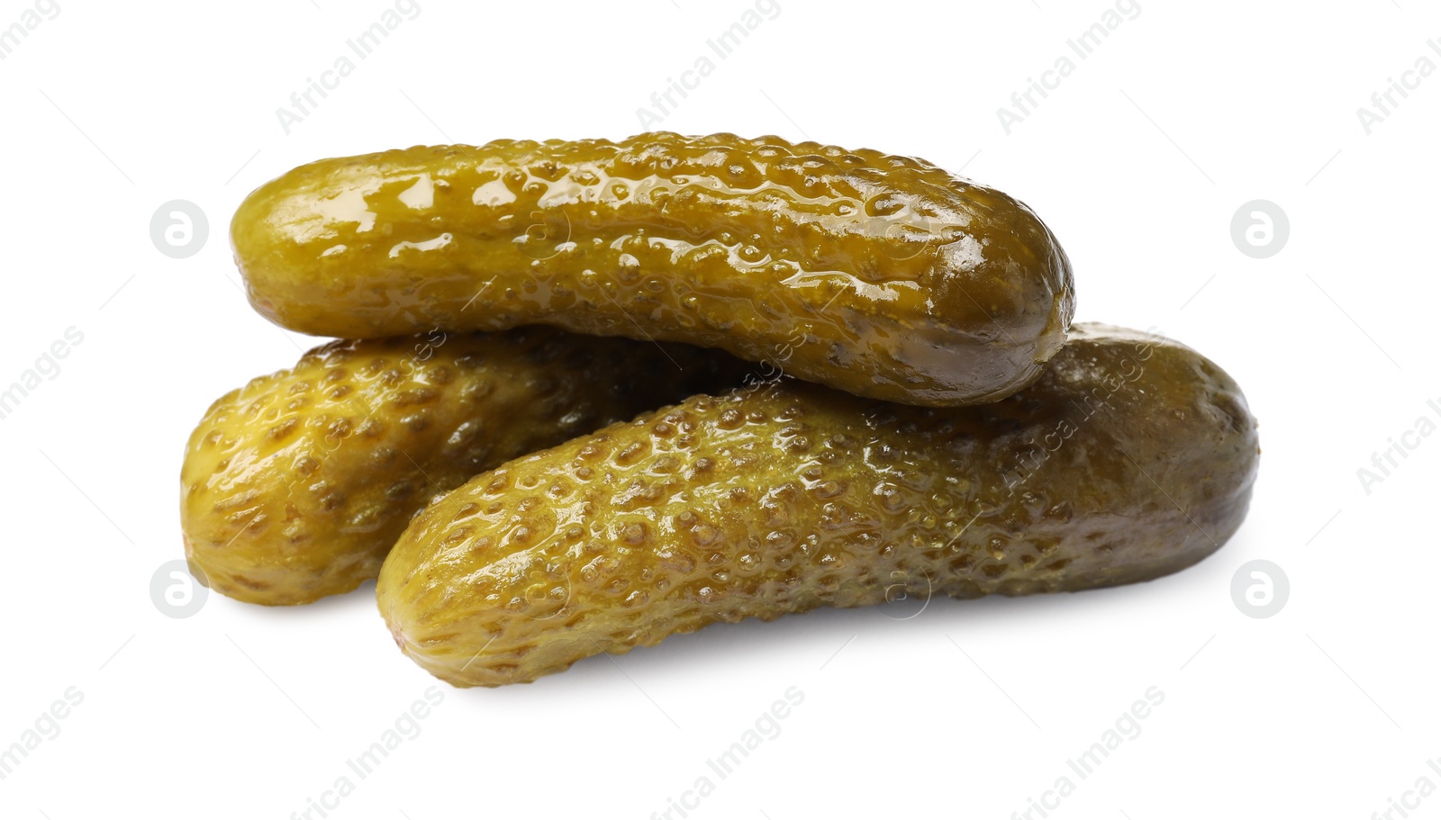 Photo of Pile of tasty pickled cucumbers isolated on white