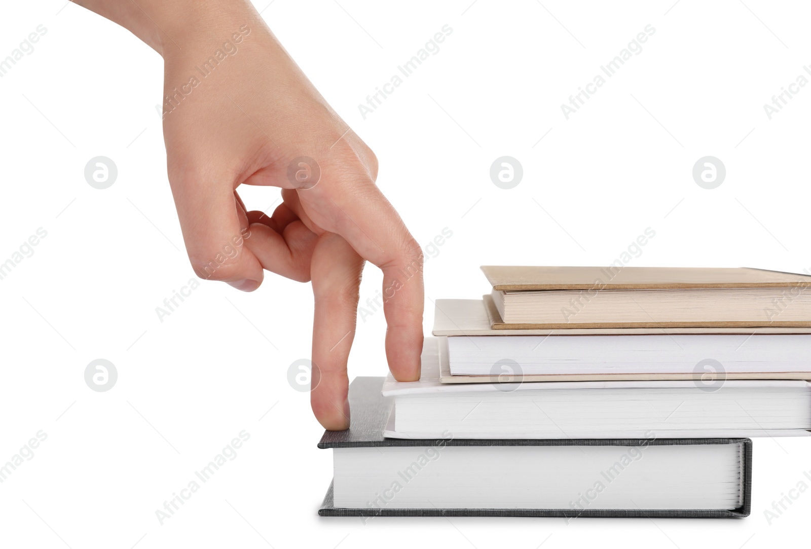 Photo of Woman imitating stepping up on books with her fingers against white background, closeup