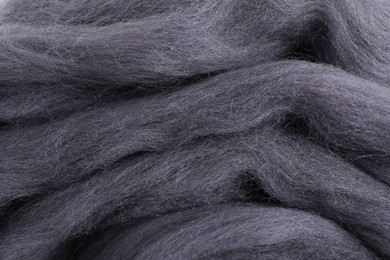 Photo of Grey felting wool as background, closeup view