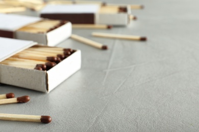 Photo of Composition with matches and space for text on light background