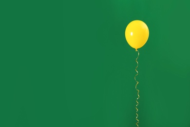 Photo of Bright balloon on color background, space for text. Celebration time