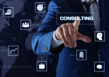 Image of Man pointing at word CONSULTING on virtual screen, closeup