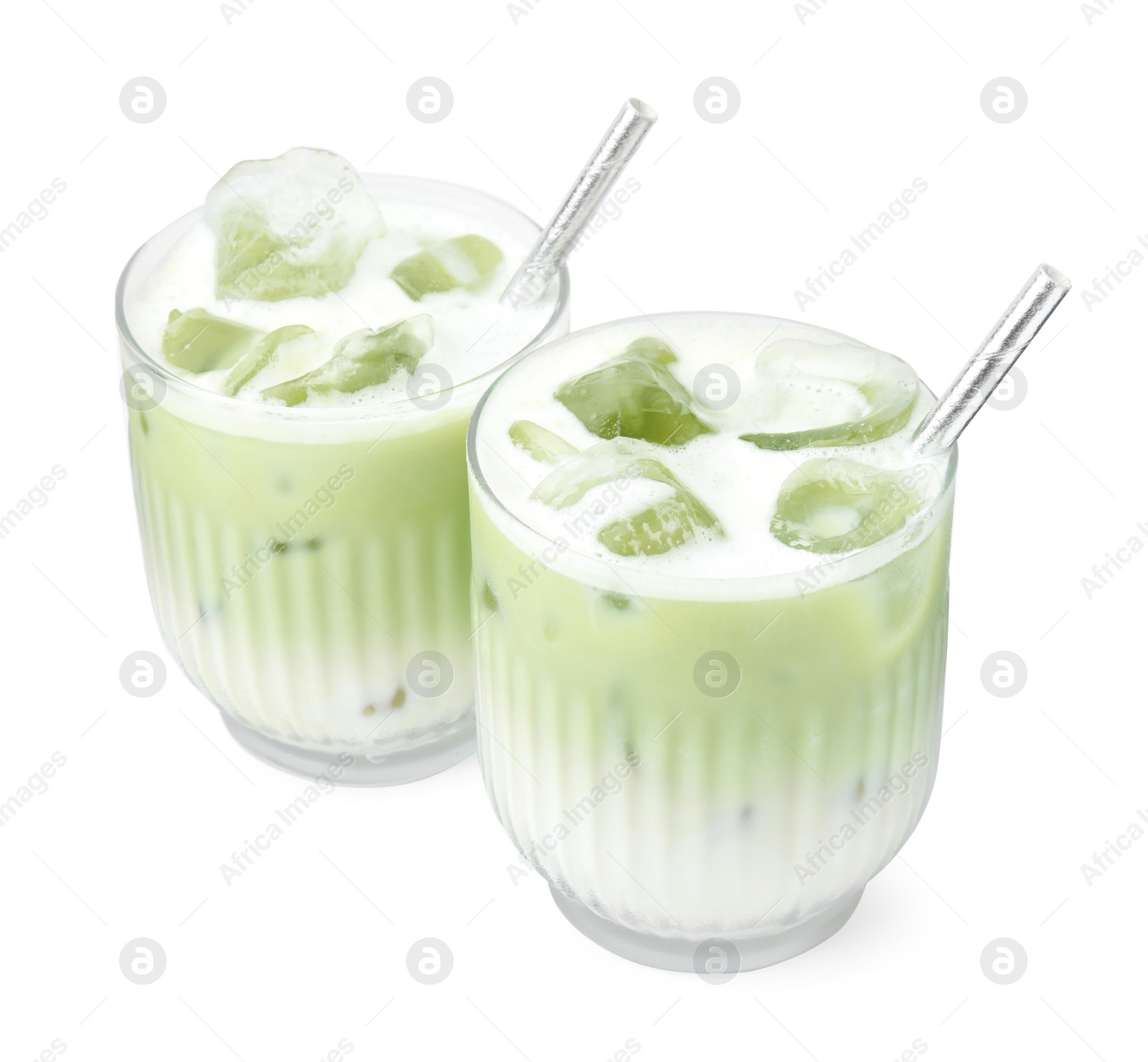 Photo of Glasses of tasty iced matcha latte isolated on white