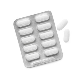 Photo of Blister pack with calcium supplement pills on white background, flat lay
