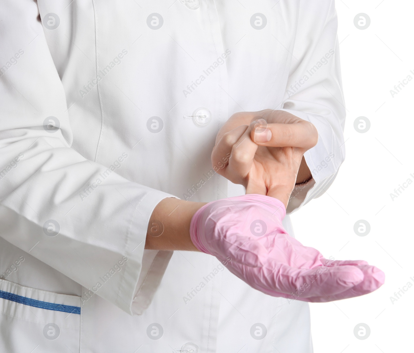 Photo of Doctor taking off medical glove on white background