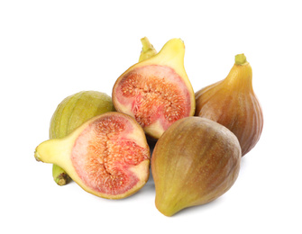 Photo of Whole and cut tasty figs isolated on white