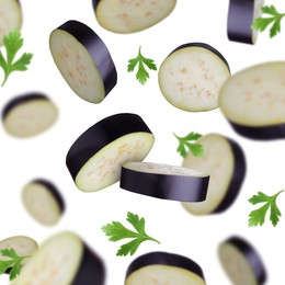 Cut eggplants and parsley falling on white background