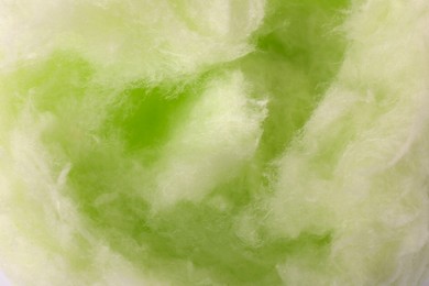 Green cotton candy as background, closeup view