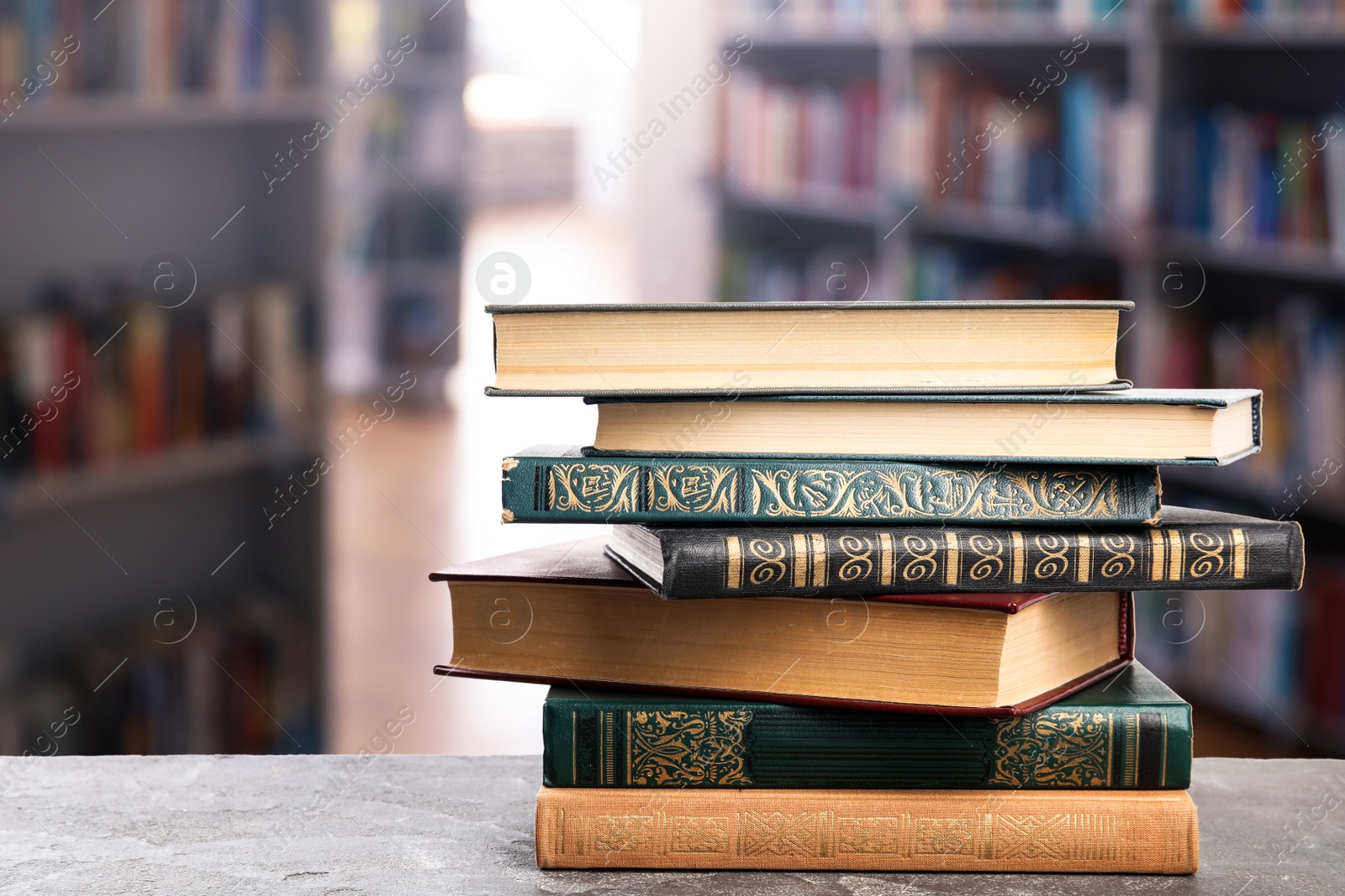 Image of Stack of old vintage books on table in library