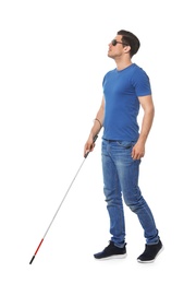 Photo of Blind man with long cane on white background