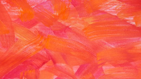 Photo of Red paint strokes drawn with brush as background, top view