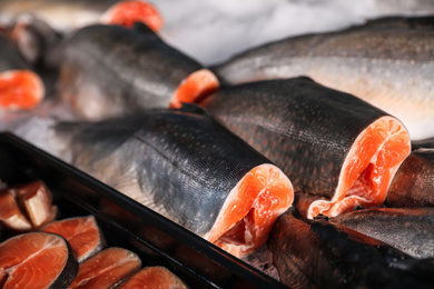 Photo of Fresh fish on ice in supermarket, closeup