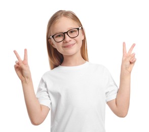 Photo of Portrait of cute girl in glasses showing victory gesture on white background