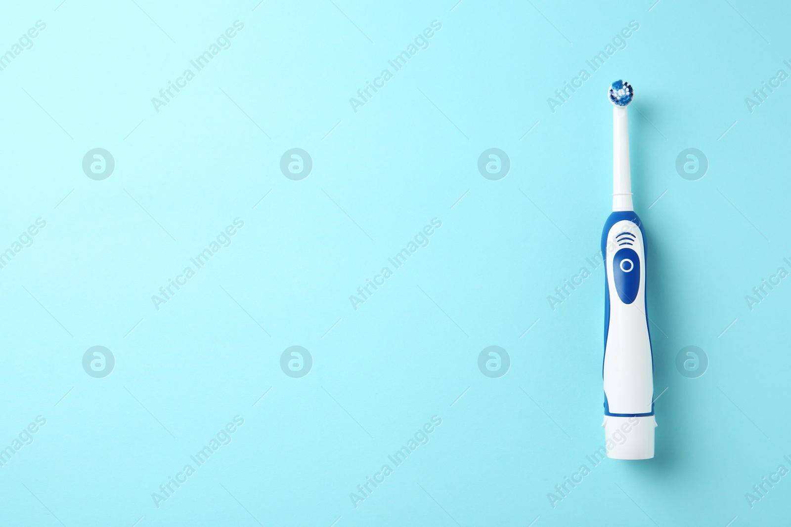 Photo of Electric toothbrush on color background. Dental care