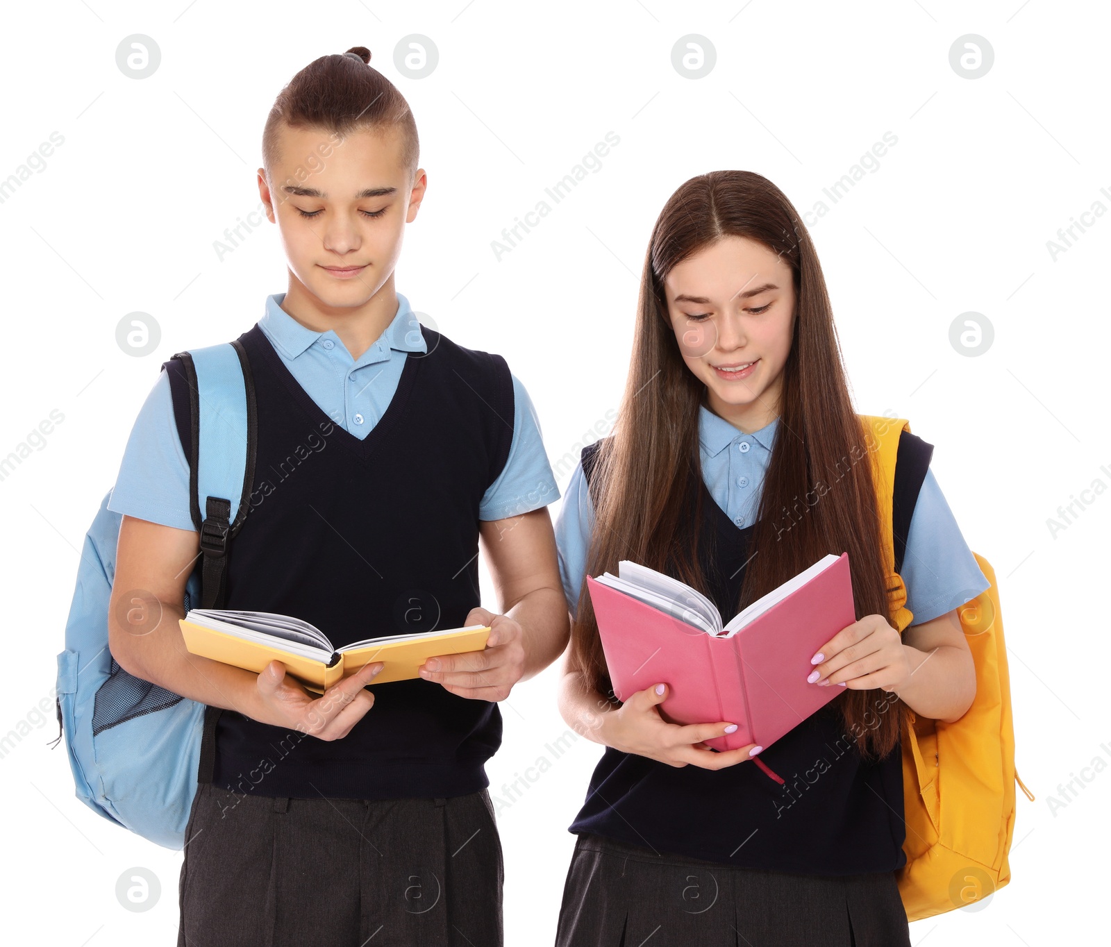 Photo of Portrait of teenagers in school uniform with books and backpacks on white background