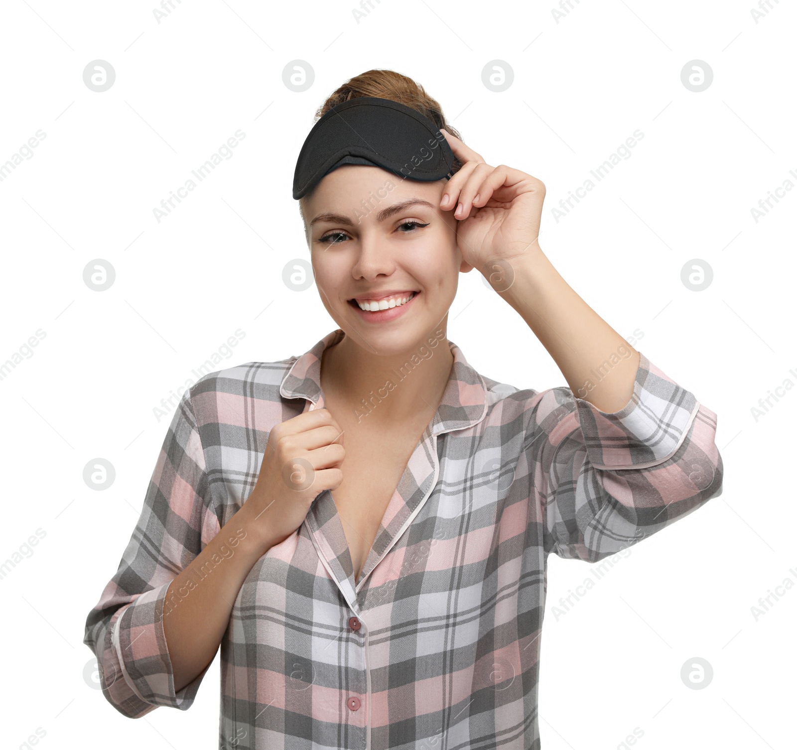 Photo of Beautiful woman wearing pajamas and sleeping mask on white background. Bedtime